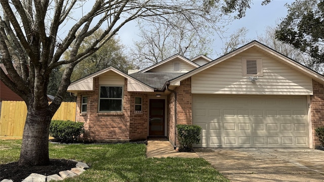 view of front of property with an attached garage, driveway, fence, and brick siding