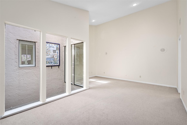 empty room featuring light carpet