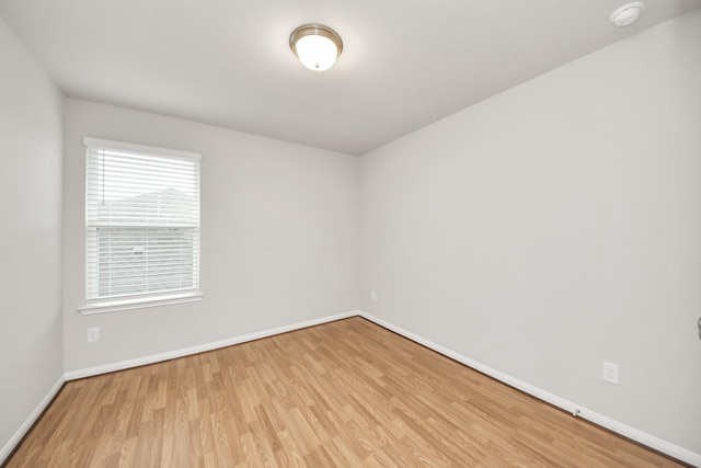 unfurnished room featuring light wood-type flooring