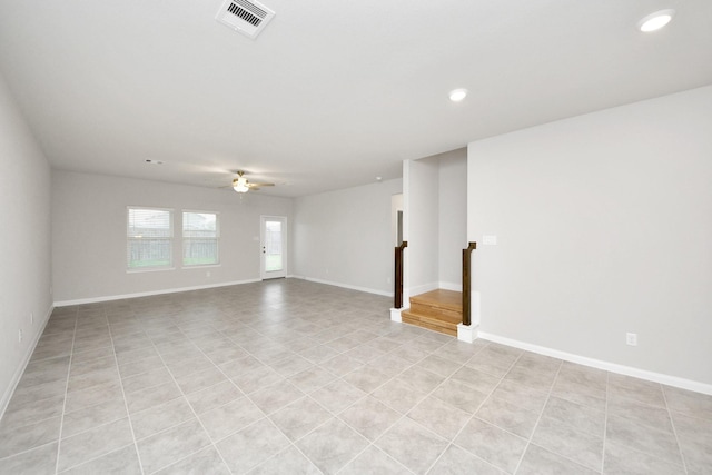 spare room with ceiling fan