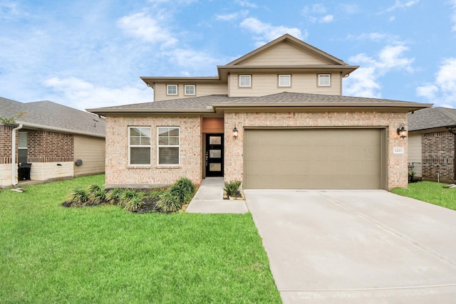 view of front facade featuring a garage and a front yard