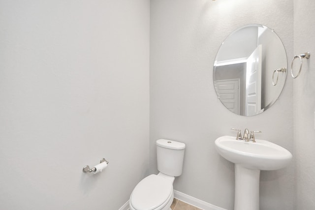 bathroom with toilet and sink