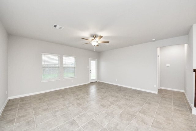 unfurnished room with ceiling fan and light tile patterned floors