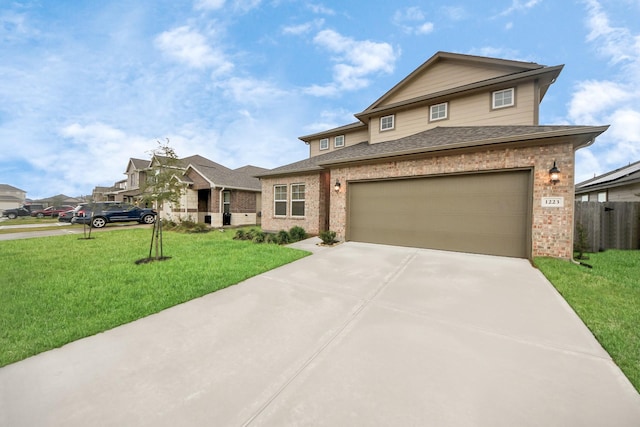 view of front facade with a garage and a front lawn