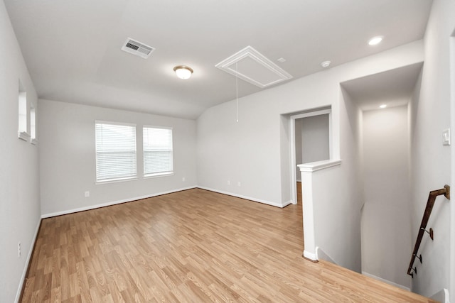 empty room with light hardwood / wood-style floors