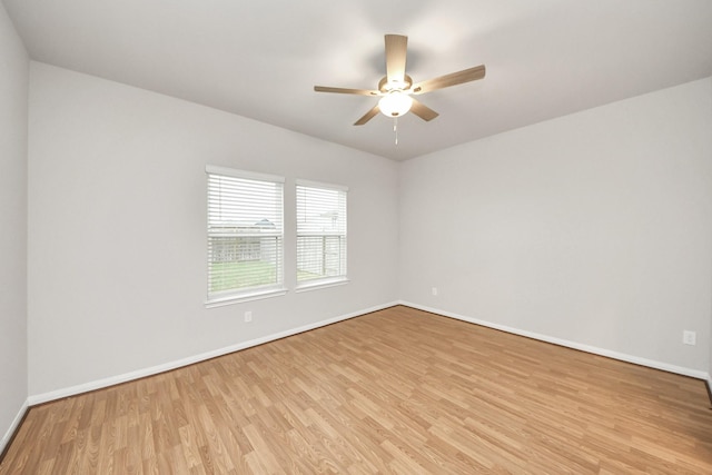 spare room with ceiling fan and light hardwood / wood-style flooring