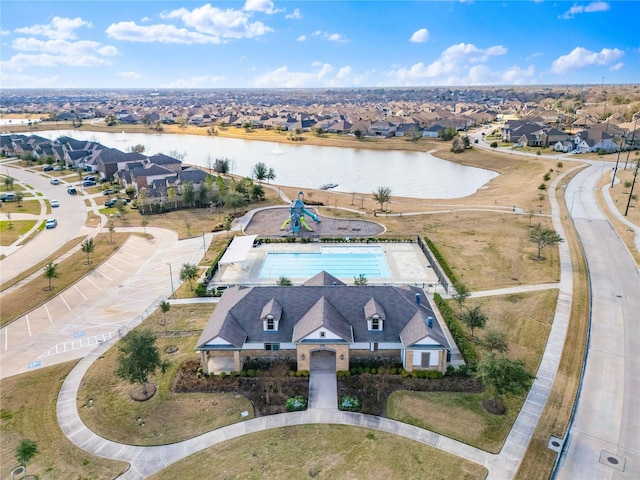 bird's eye view featuring a water view and a residential view