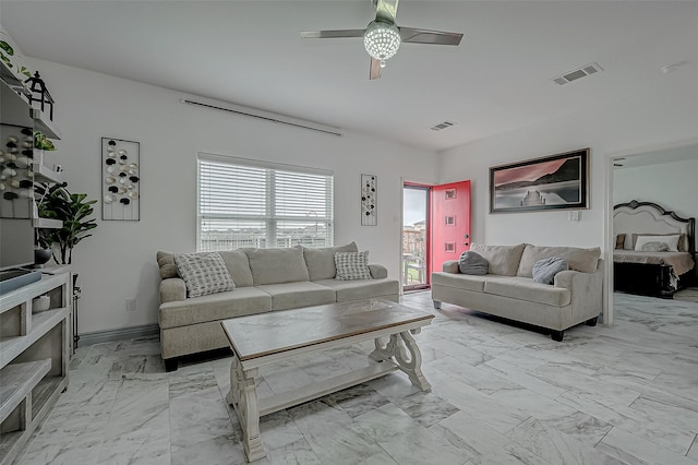 living area with marble finish floor, visible vents, and a ceiling fan