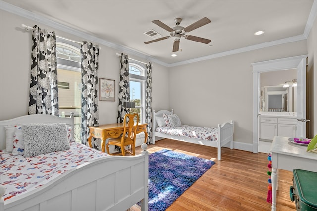 bedroom featuring light hardwood / wood-style flooring, ornamental molding, and ceiling fan