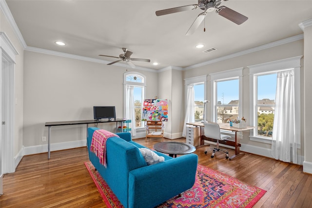 living room featuring crown molding, ceiling fan, and hardwood / wood-style flooring