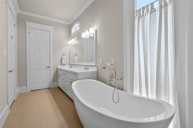 bathroom featuring vanity, a bath, and crown molding