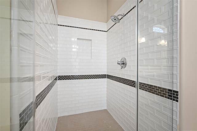 bathroom with tiled shower