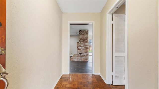 hallway featuring dark parquet floors