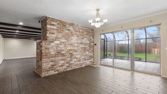 unfurnished dining area featuring beam ceiling, brick wall, ornamental molding, dark hardwood / wood-style floors, and ceiling fan with notable chandelier