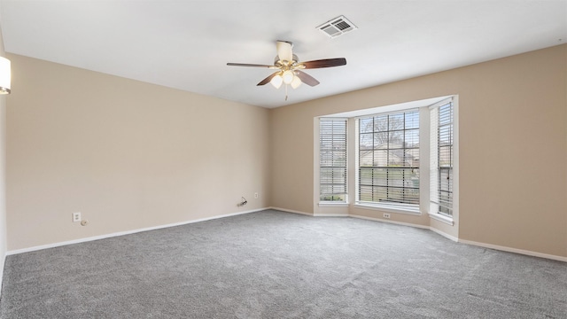 carpeted empty room with ceiling fan