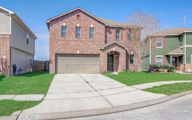 view of front facade with a garage and a front yard