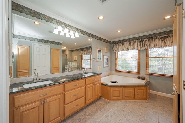 full bathroom featuring a bath, ornamental molding, and a sink