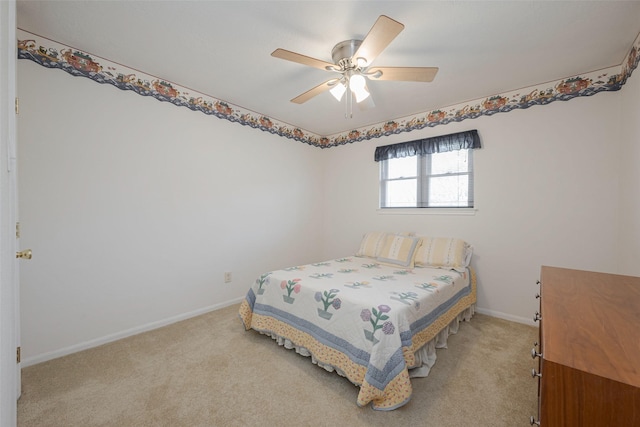 bedroom with ceiling fan, baseboards, and light colored carpet