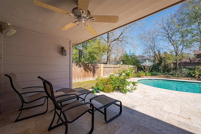 view of patio / terrace featuring a fenced backyard, ceiling fan, and a fenced in pool