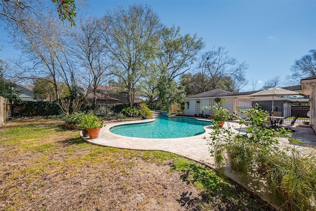 view of swimming pool with a fenced in pool, a fenced backyard, and a patio