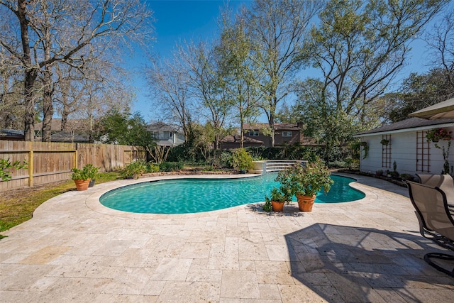 view of pool featuring a patio, a fenced backyard, and a fenced in pool