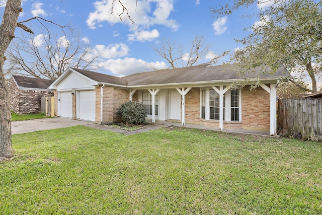 ranch-style home featuring a garage and a front lawn