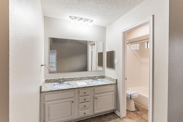 full bathroom featuring shower / bathtub combination, vanity, toilet, and a textured ceiling