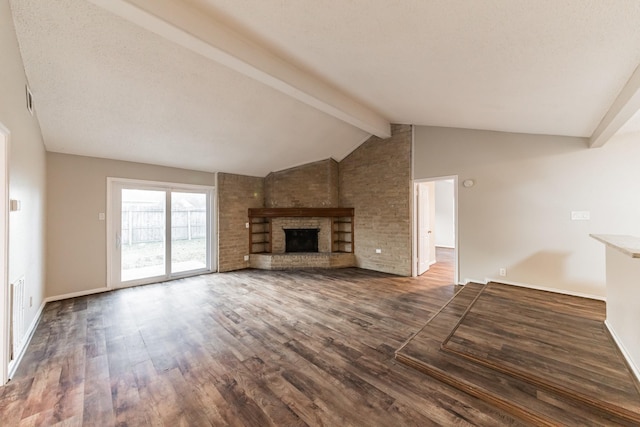 unfurnished living room with dark hardwood / wood-style floors, vaulted ceiling with beams, and a fireplace