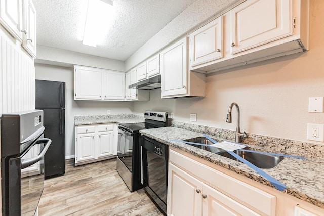 kitchen featuring sink, black appliances, a textured ceiling, light hardwood / wood-style floors, and white cabinets