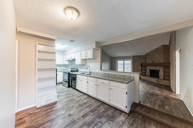 kitchen featuring white cabinetry, dark stone countertops, dark hardwood / wood-style flooring, and stainless steel electric range