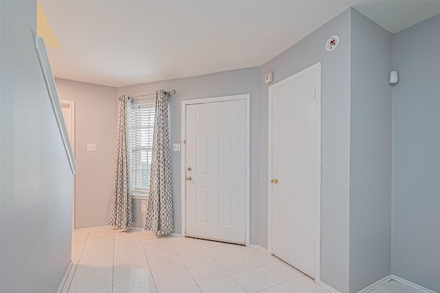 entryway featuring light tile patterned flooring