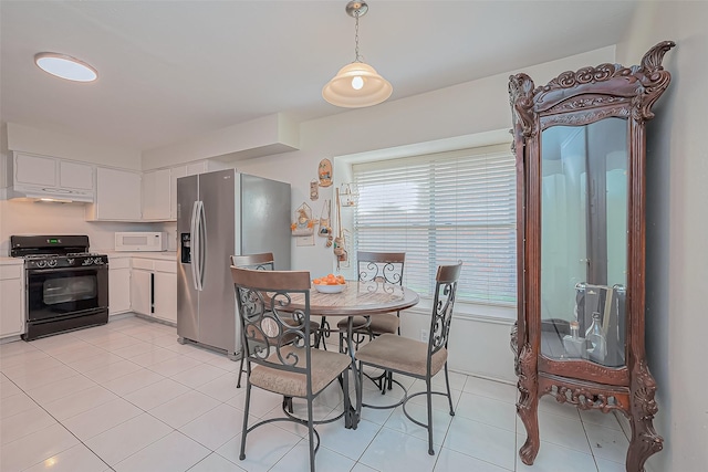 dining space with light tile patterned floors