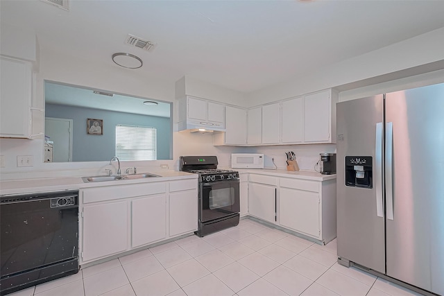 kitchen featuring white cabinetry, black appliances, light countertops, and a sink