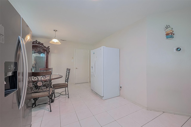 dining room with light tile patterned flooring