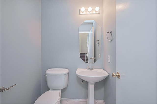 bathroom featuring toilet and a sink