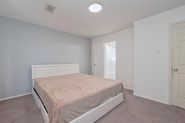 carpeted bedroom with baseboards and visible vents