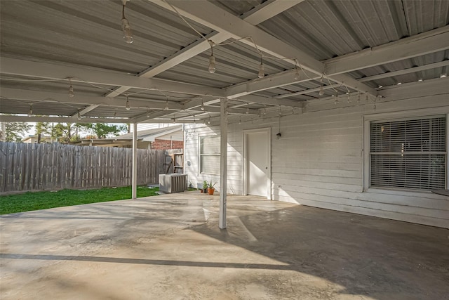 view of patio with central AC and fence