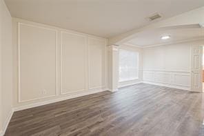 spare room featuring dark wood-type flooring