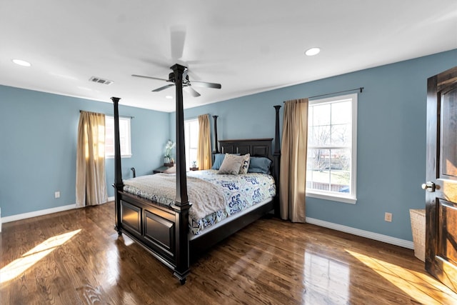 bedroom with dark wood-style flooring, recessed lighting, visible vents, and baseboards