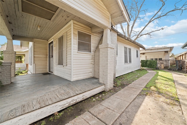 view of side of property featuring a porch