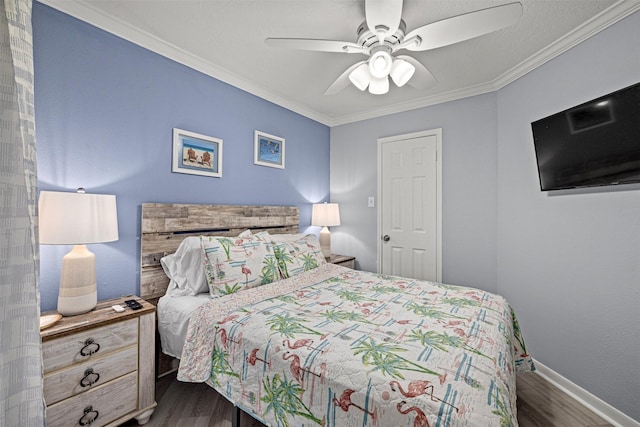 bedroom with ceiling fan, ornamental molding, and dark hardwood / wood-style flooring