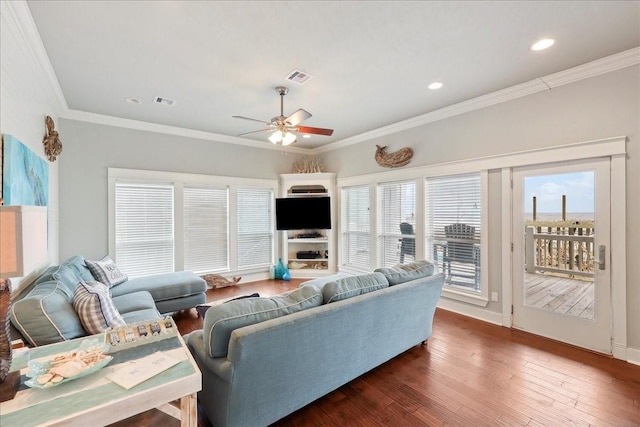 2904 Shady Ln, Crystal Beach, TX 77650 - living room with dark wood-type flooring, ornamental molding, and ceiling fan