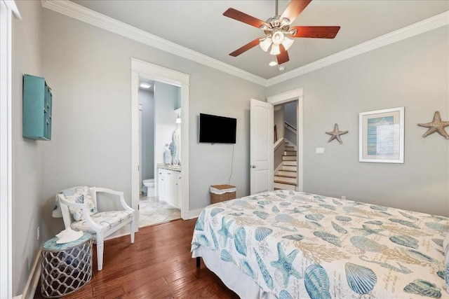 2904 Shady Ln, Crystal Beach, TX 77650 - bedroom with crown molding, ceiling fan, dark hardwood / wood-style flooring, and ensuite bath