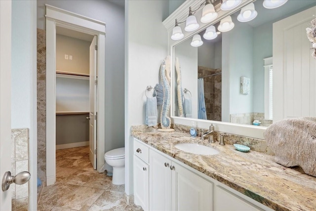 2904 Shady Ln, Crystal Beach, TX 77650 - bathroom with vanity, toilet, and a shower with curtain