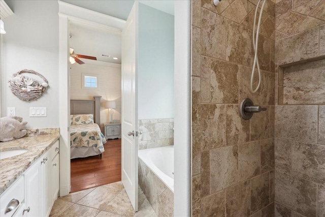 2904 Shady Ln, Crystal Beach, TX 77650 - bathroom with ceiling fan, vanity, separate shower and tub, and tile patterned flooring