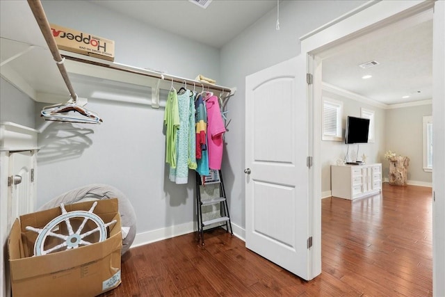 2904 Shady Ln, Crystal Beach, TX 77650 - spacious closet featuring hardwood / wood-style floors
