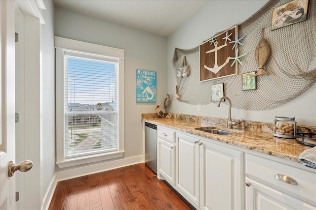2904 Shady Ln, Crystal Beach, TX 77650 - interior space featuring sink, dishwasher, white cabinetry, dark hardwood / wood-style floors, and light stone countertops