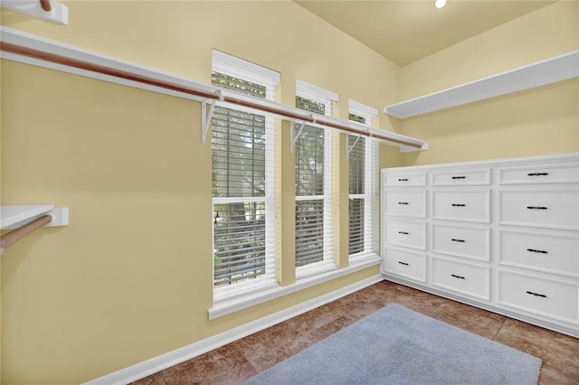 spacious closet with tile patterned floors