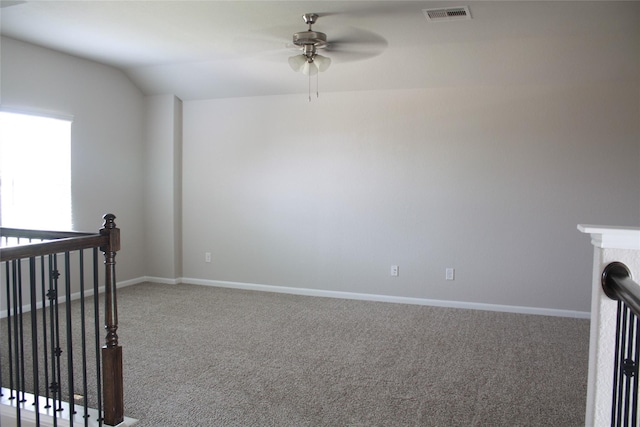 unfurnished room with carpet floors, ceiling fan, and vaulted ceiling