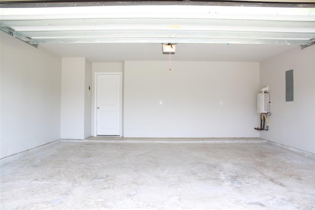 garage featuring a garage door opener, electric panel, and tankless water heater